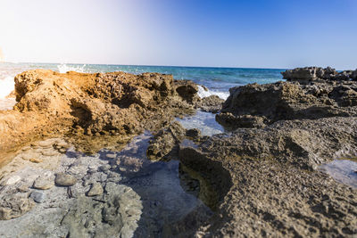 Scenic view of sea against clear blue sky