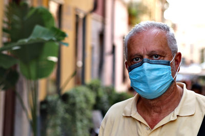 Portrait of man standing outdoors