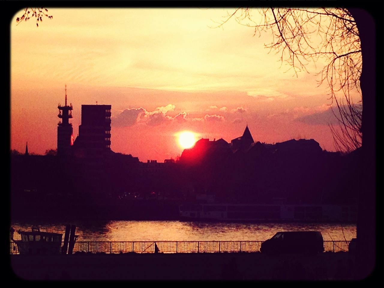 sunset, silhouette, transfer print, sky, auto post production filter, sun, orange color, built structure, architecture, cloud - sky, building exterior, scenics, water, beauty in nature, nature, tranquil scene, tranquility, cloud, sunlight, river