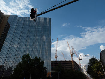 Low angle view of modern buildings against sky