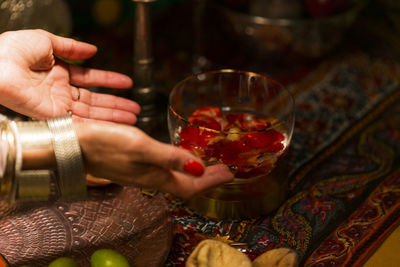 Close-up of hand holding wine glass