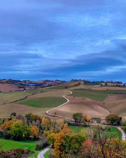 Scenic view of agricultural landscape against sky