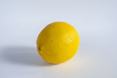 Close-up of lemon against white background