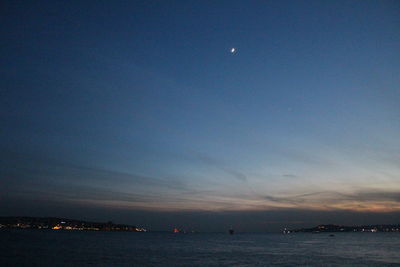 Scenic view of sea against sky at night