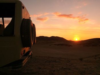 Scenic view of landscape against sky during sunset