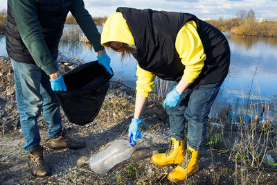 Low section of people working in water