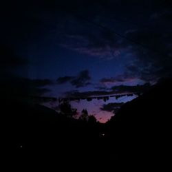 Silhouette of trees against sky at sunset