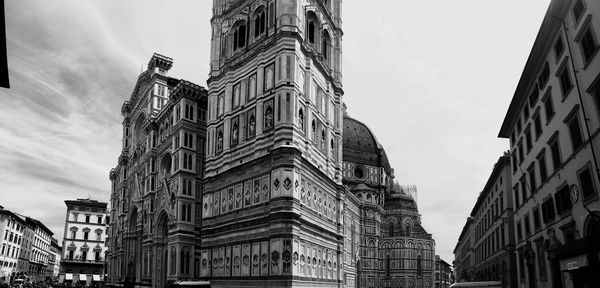 Low angle view of buildings in city against sky