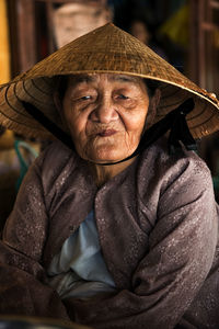 Portrait of smiling woman wearing hat