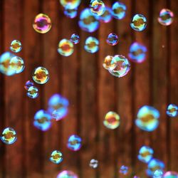 Bubbles against wooden wall