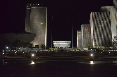 Modern buildings in city at night