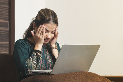 Young woman using mobile phone