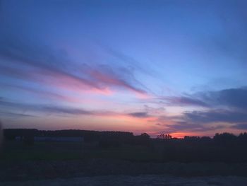 Scenic view of silhouette landscape against sky during sunset