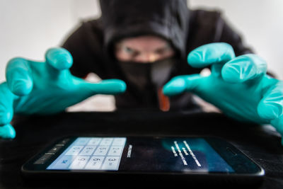 Cropped hand using laptop