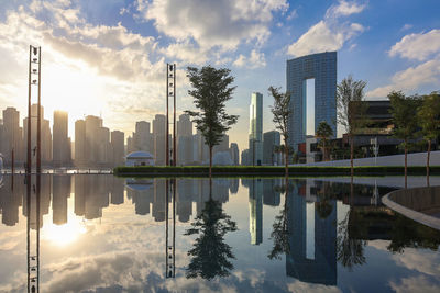 Panoramic view of business bay district with reflection in sea in morning. aerial sky at highest 