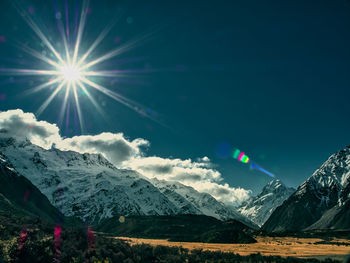 Scenic view of snowcapped mountains against sky