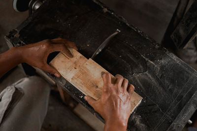 High angle view of man working on wood