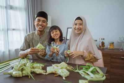 Portrait of family sitting at home