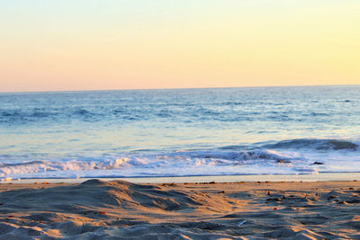 Scenic view of sea at sunset