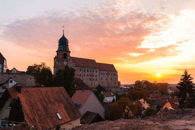 Historic building against sky at sunset