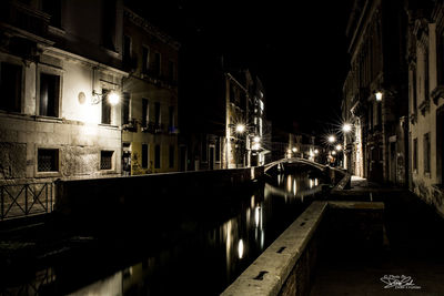 Illuminated buildings in city at night