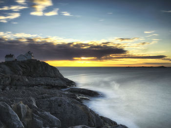 Scenic view of sea against sky during sunset