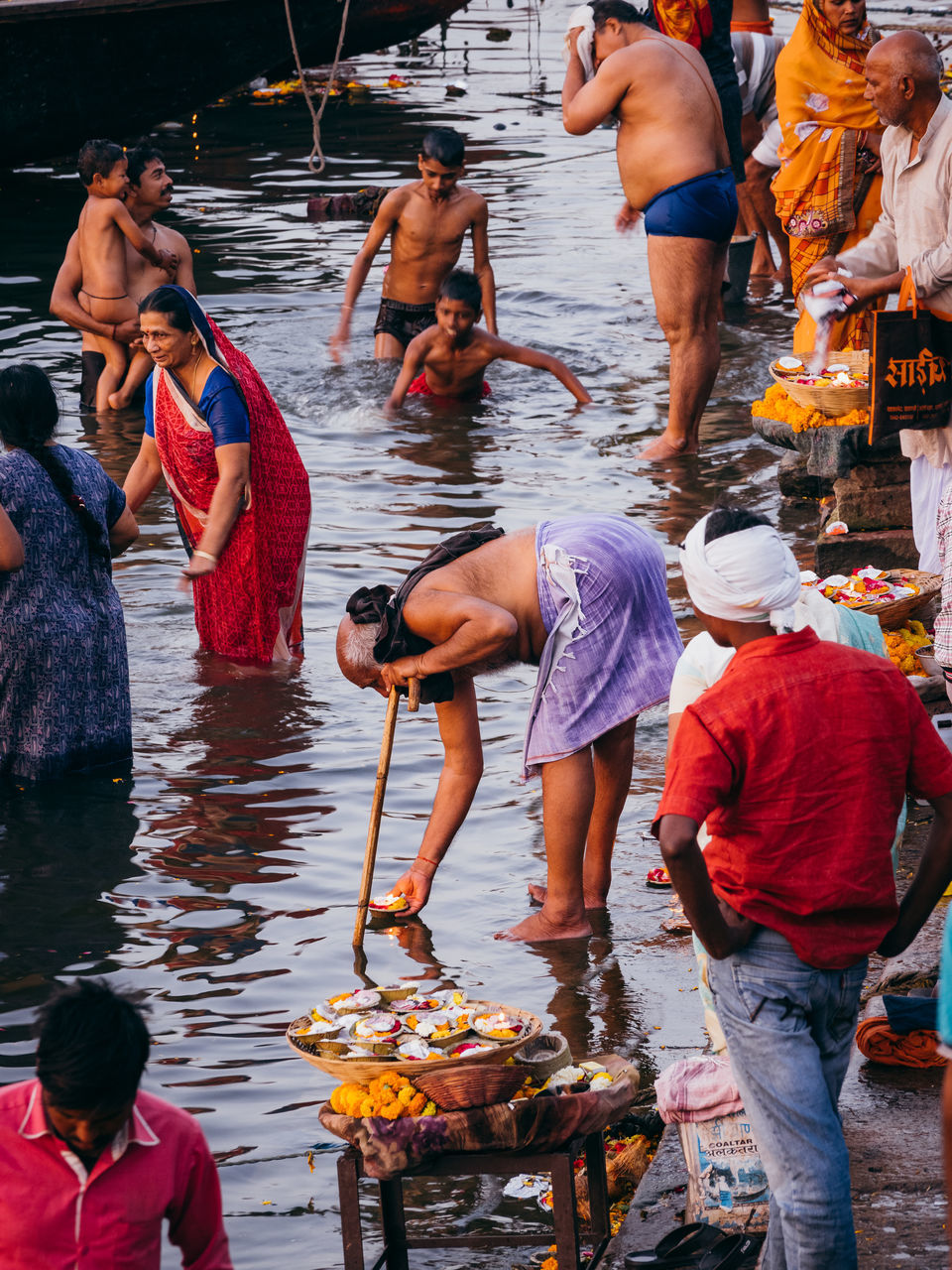 group of people, real people, water, large group of people, men, day, crowd, women, occupation, lifestyles, retail, food, market, outdoors, adult, belief, casual clothing, religion