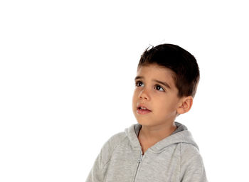 Portrait of cute boy against white background