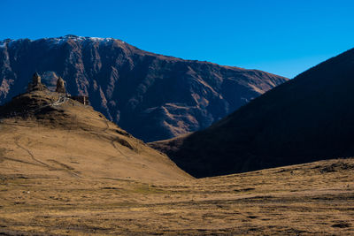 Scenic view of mountains against clear sky