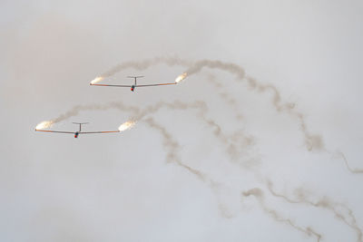 Low angle view of airplane flying in sky