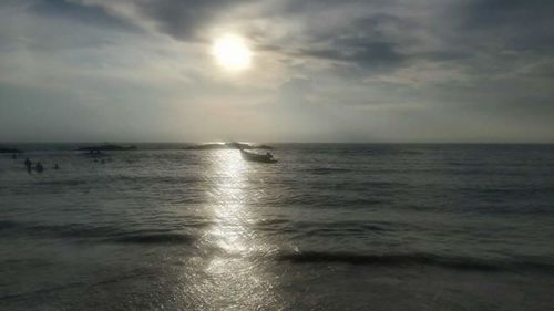 Scenic view of sea against cloudy sky