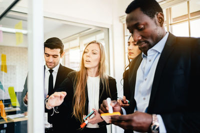 Male and female entrepreneurs brainstorming at office