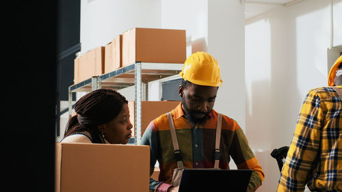 Rear view of man working at office