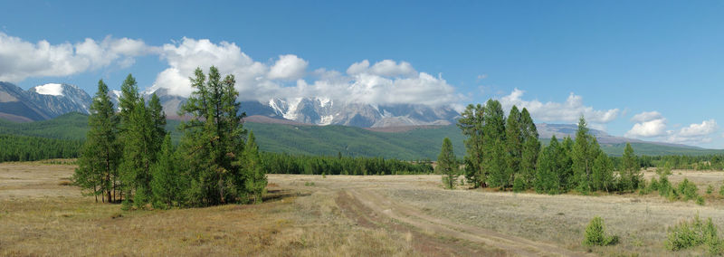 Scenic view of mountains against cloudy sky