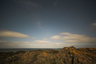 Scenic view of landscape against sky at night