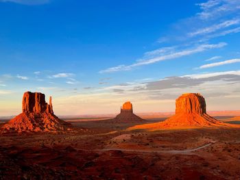 Scenic view of desert against sky during sunset