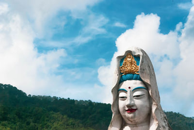 Low angle view of statue against sky