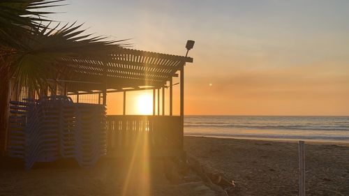 Scenic view of beach at sunset