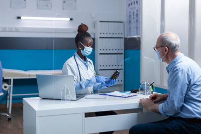 Doctor consulting with patient in clinic