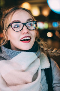 Close-up portrait of smiling young woman