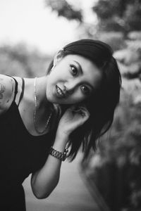 Smiling young woman wearing earring