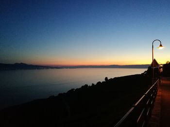 Scenic view of sea against clear sky during sunset