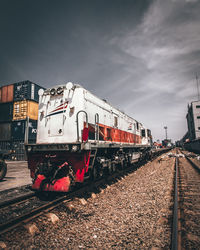 Train on railroad tracks against sky