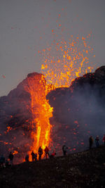 View of bonfire against mountain range