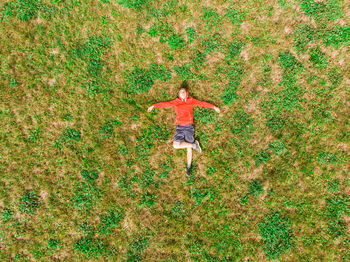 High angle view of person on field. aerial view of relaxing person on grass 