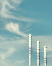 Low angle view of smoke stack against sky