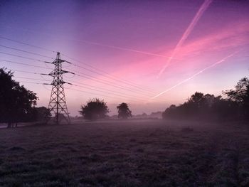 View of foggy field at dusk