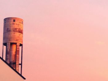 Low angle view of smoke stack against sky