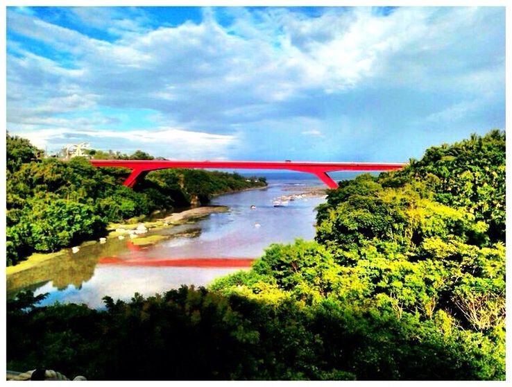 tree, sky, water, connection, bridge - man made structure, cloud - sky, built structure, architecture, river, transfer print, bridge, cloudy, auto post production filter, cloud, waterfront, transportation, tranquility, nature, beauty in nature, scenics