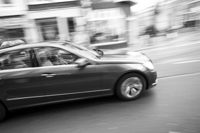 Blurred motion of car on street